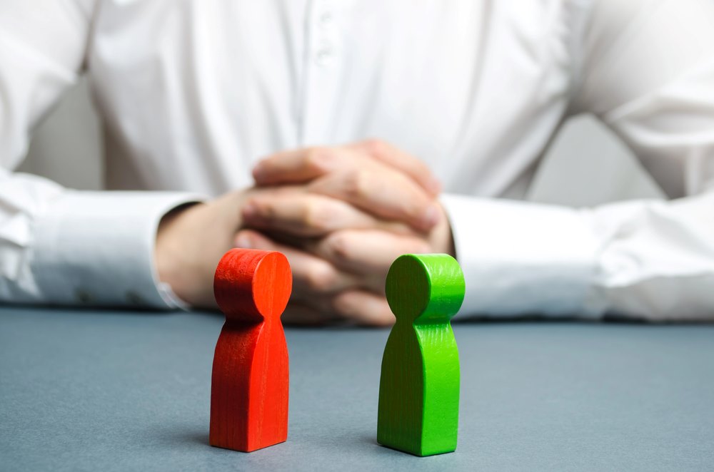 Image of an arbitrator examining a conflict situation between people, featuring 411 Corporate Law and highlighting strategies for avoiding legal disputes and shareholder conflicts, ensuring it aligns with the page's context on corporate governance and conflict resolution.