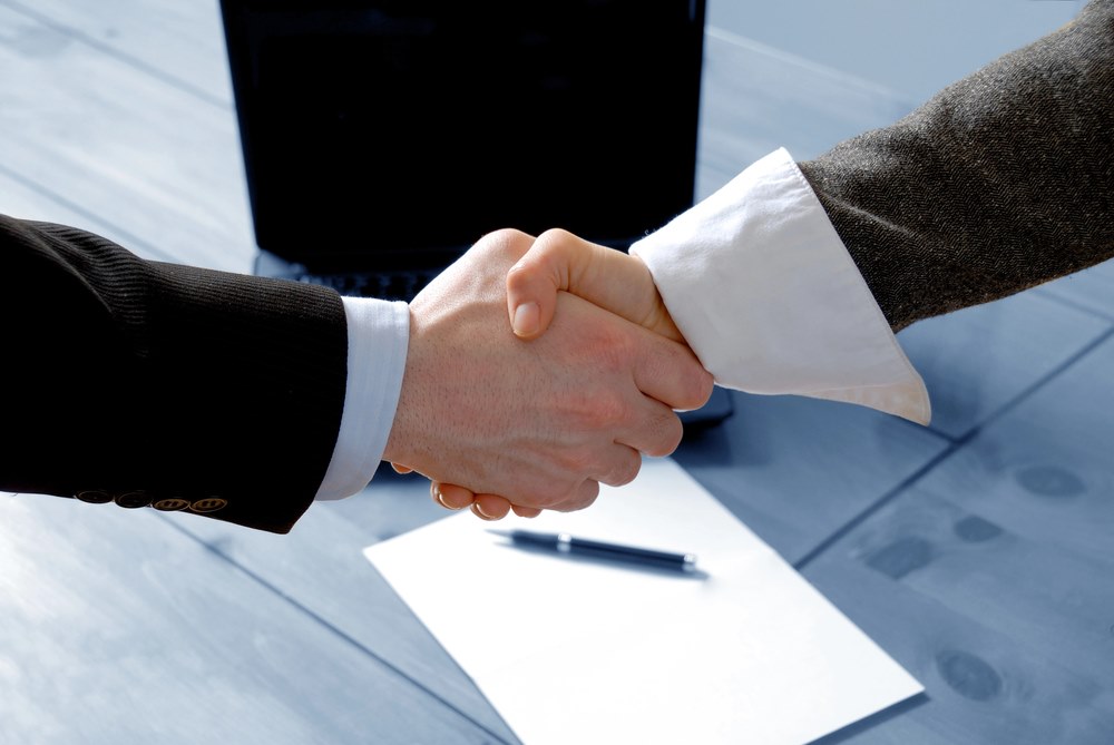 Image of two people shaking hands, featuring 411 Corporate Law and highlighting 'Negotiation,' ensuring it aligns with the page's context on corporate negotiation and business agreements.