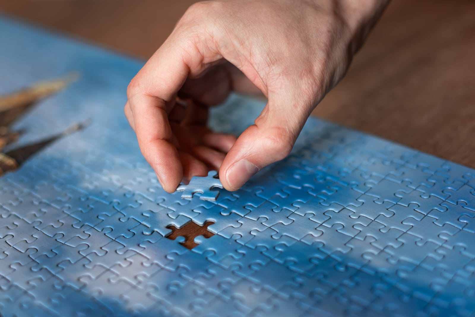 Voluntary Dissolution Image of the last piece being placed in a jigsaw puzzle, symbolizing solutions and completion, featuring the 411 Corporate Law logo and highlighting 'Voluntary Dissolution,' aligning with the page's focus on corporate legal processes.