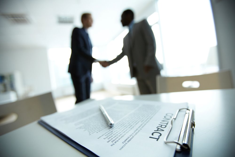 What Are Corporate Contracts Image of a business deal handshake, featuring 411 Corporate Law and highlighting 'What Are Corporate Contracts?' to align with the page's context on corporate agreements and legal obligations.